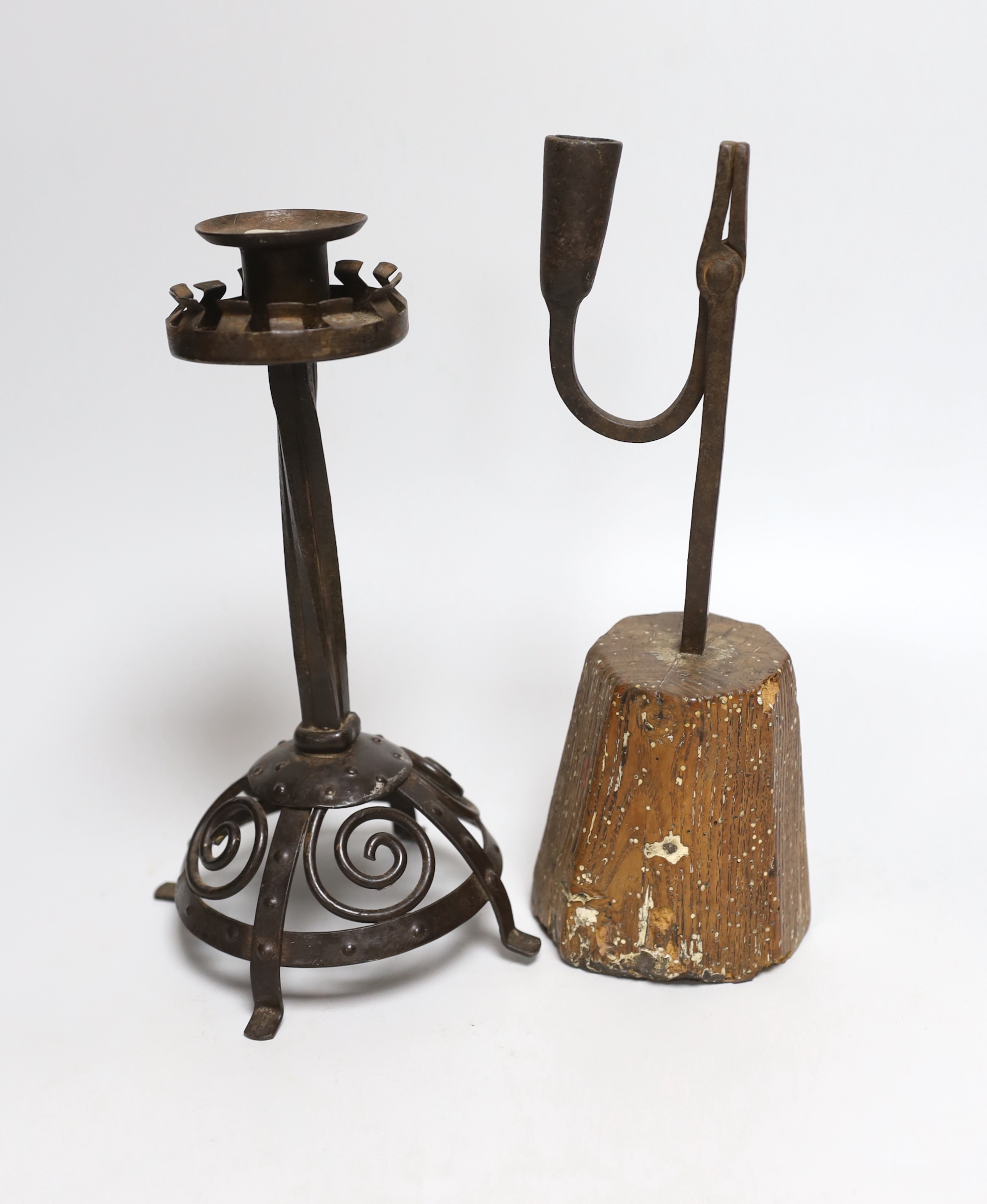 An 18th century rushlight and a wrought iron candlestick, rush light 26cm high